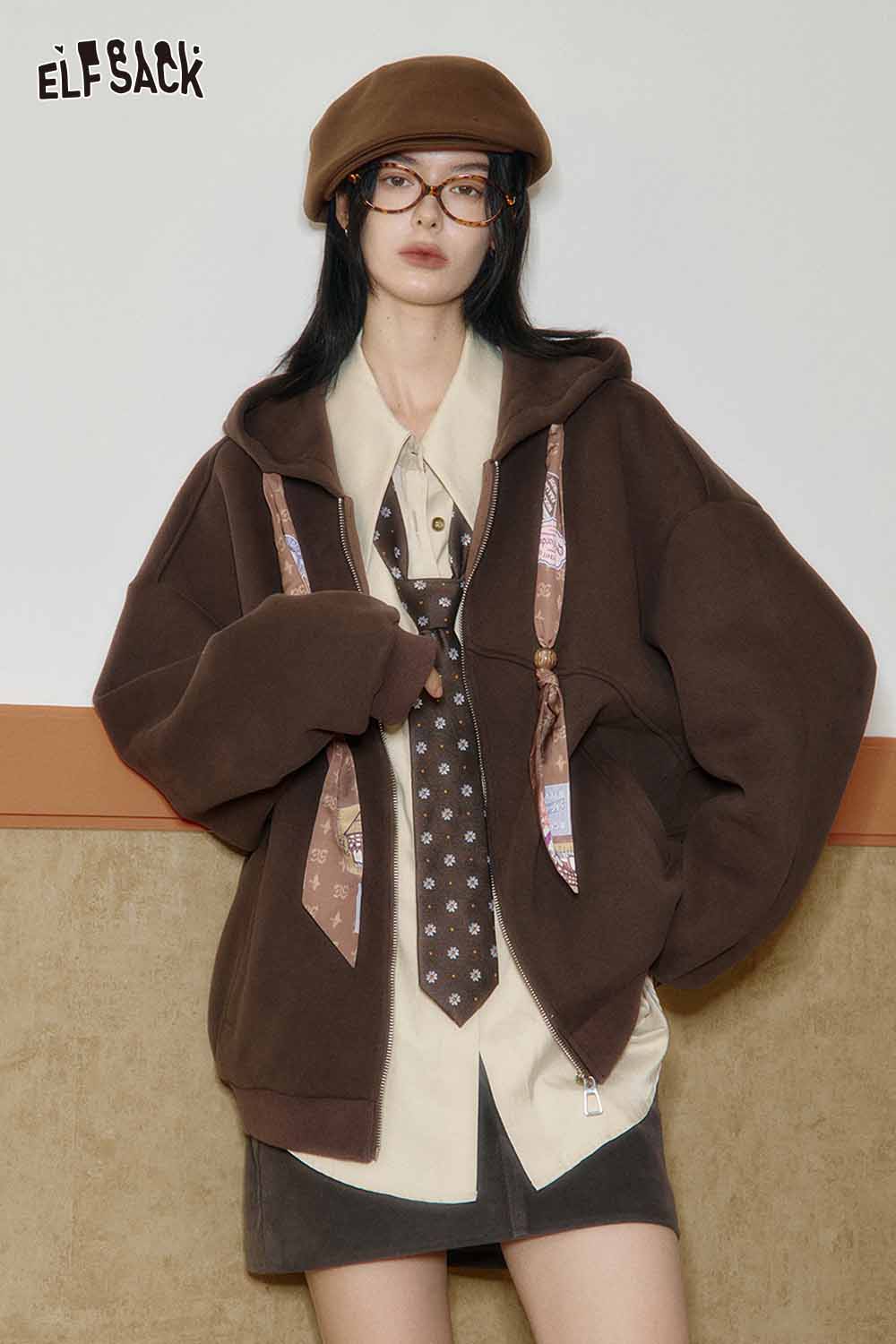ELFSACK artistic embroidery oversized shirt layered under a brown hoodie, styled with a tie and glasses