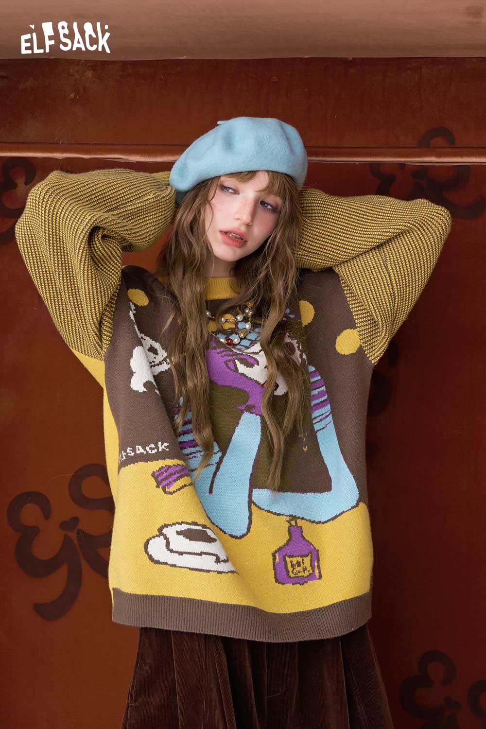 ELFSACK artistic graphic sweater for women featuring a colorful design and relaxed fit