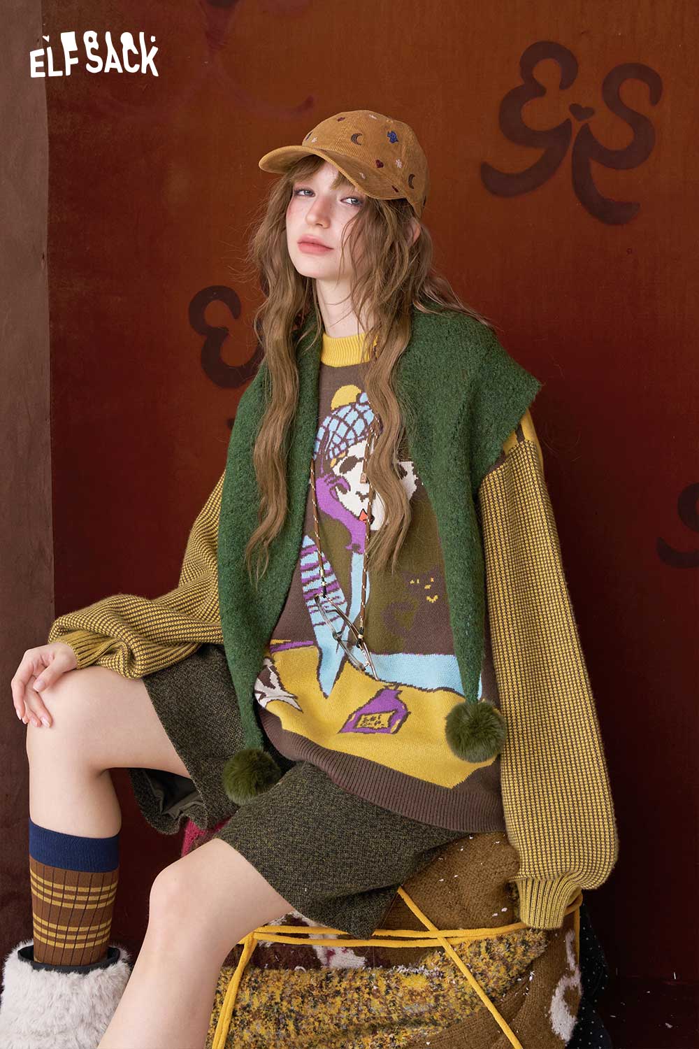 ELFSACK artistic graphic sweater for women featuring vibrant colors and unique design, paired with casual shorts