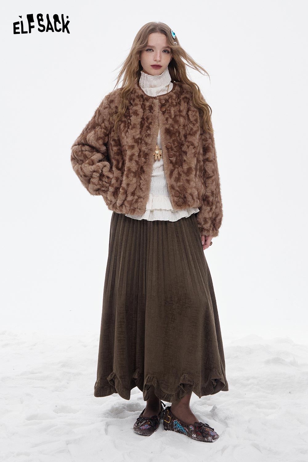 ELFSACK asymmetric flounce hem skirt in brown, featuring a pleated design, styled with a cozy faux fur jacket