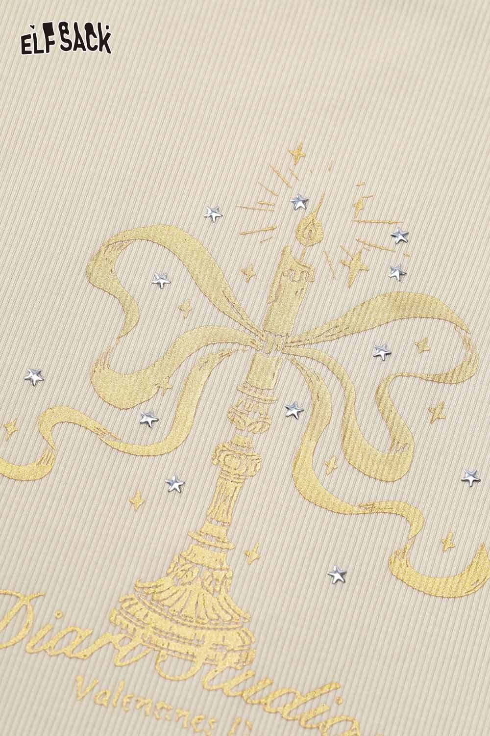 ELFSACK asymmetric neckline graphic tee featuring a candle design with sparkle details