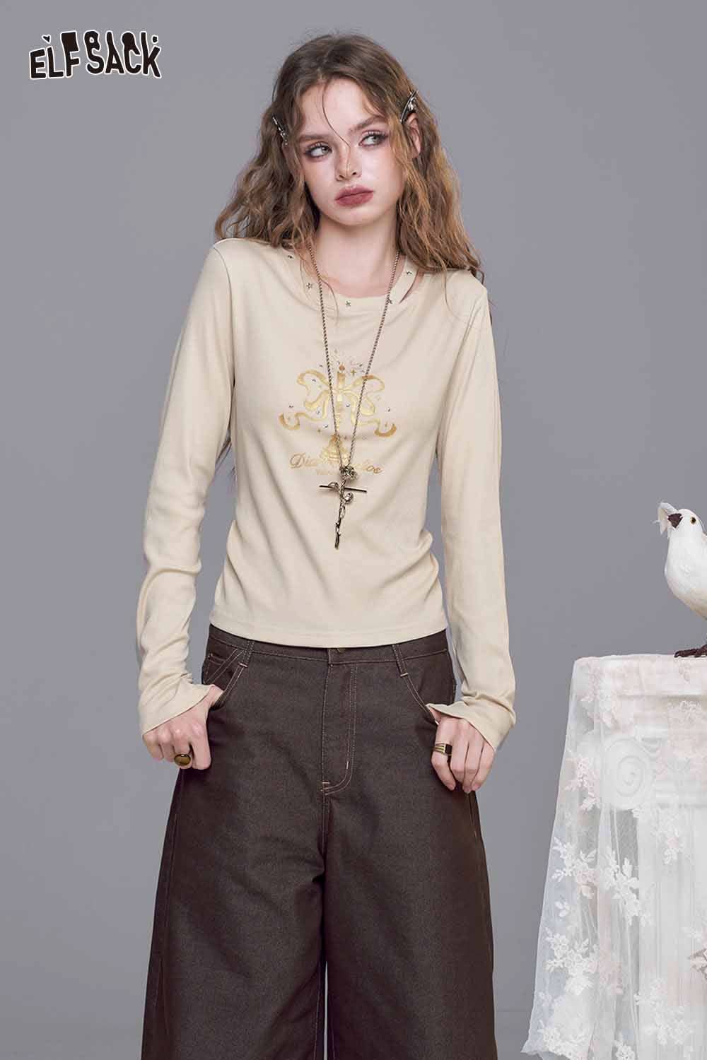 ELFSACK asymmetric neckline graphic tee in beige with delicate graphic design and long sleeves