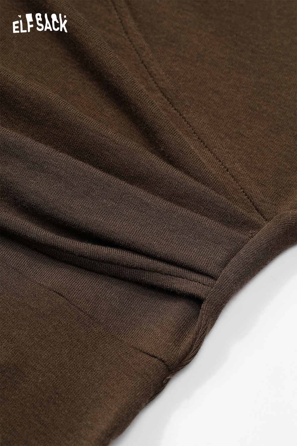 Detail of ELFSACK asymmetric neckline midi dress in brown with soft fabric and chic design