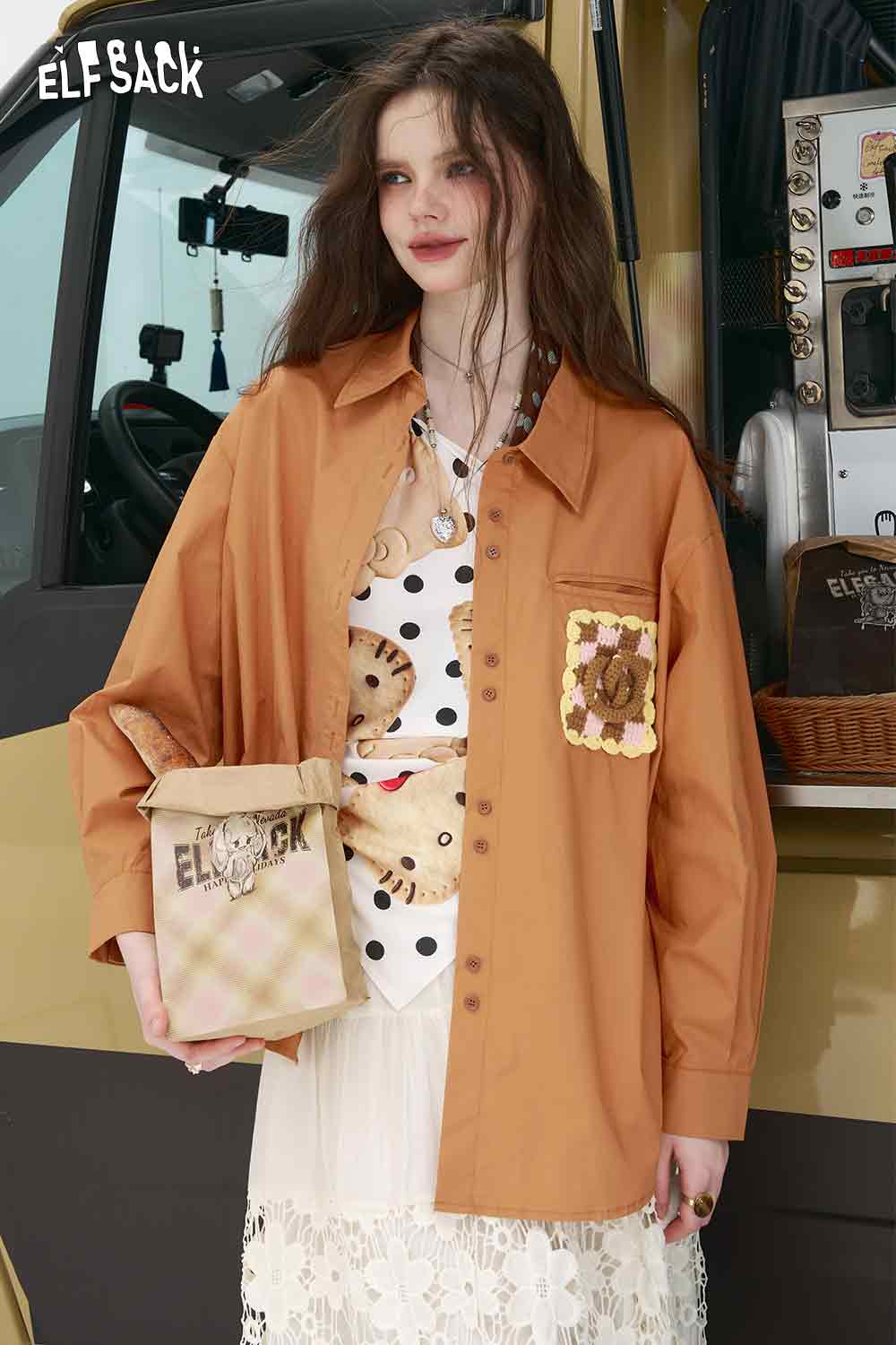 ELFSACK oversized rust button shirt with crochet pocket detail on model 3D handmade crocheted shirt