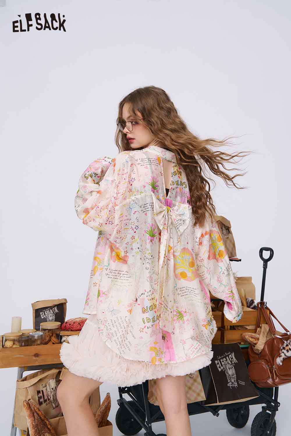 ELFSACK oversized pastel graffiti cartoon print shirt for women shown on model with bow tie back