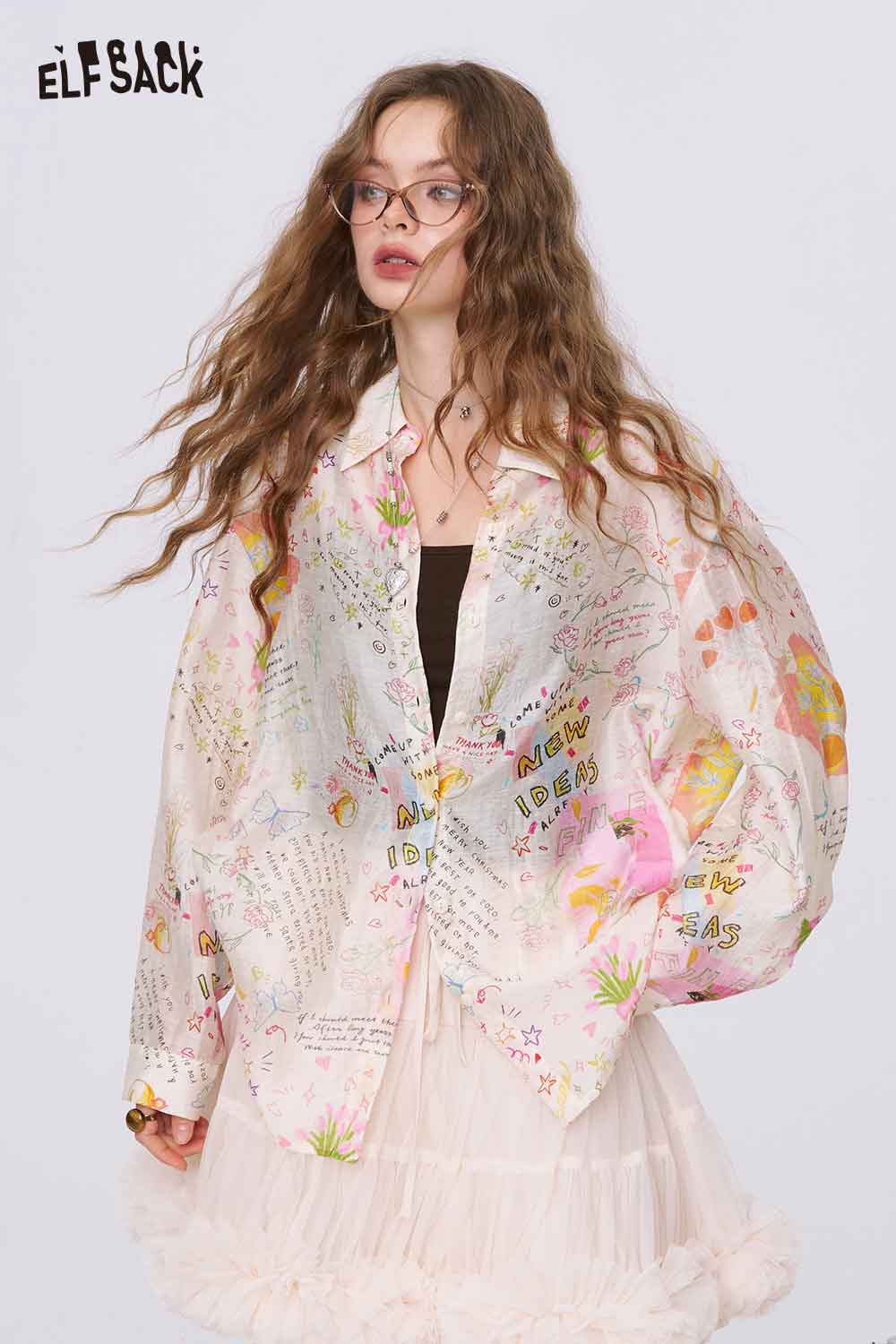 ELFSACK oversized graffiti cartoon print shirt for women in pastel colors worn with black tank and tulle skirt