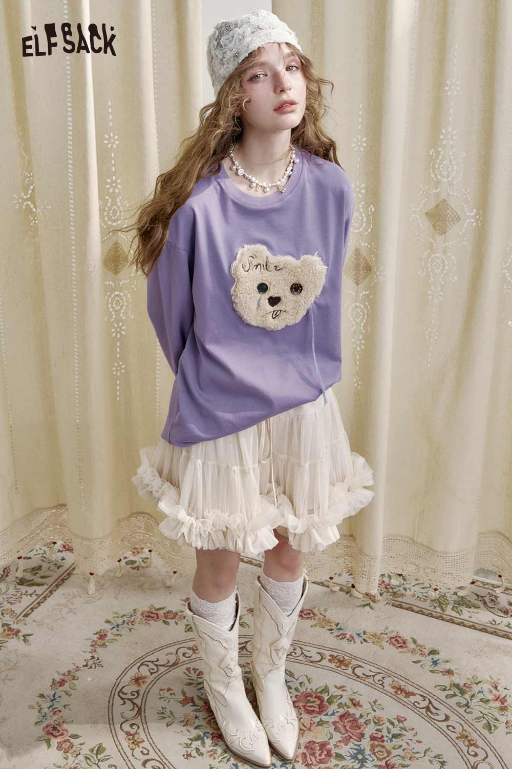 ELFSACK ballerina style tulle skirt paired with a cozy sweater and trendy cowgirl boots