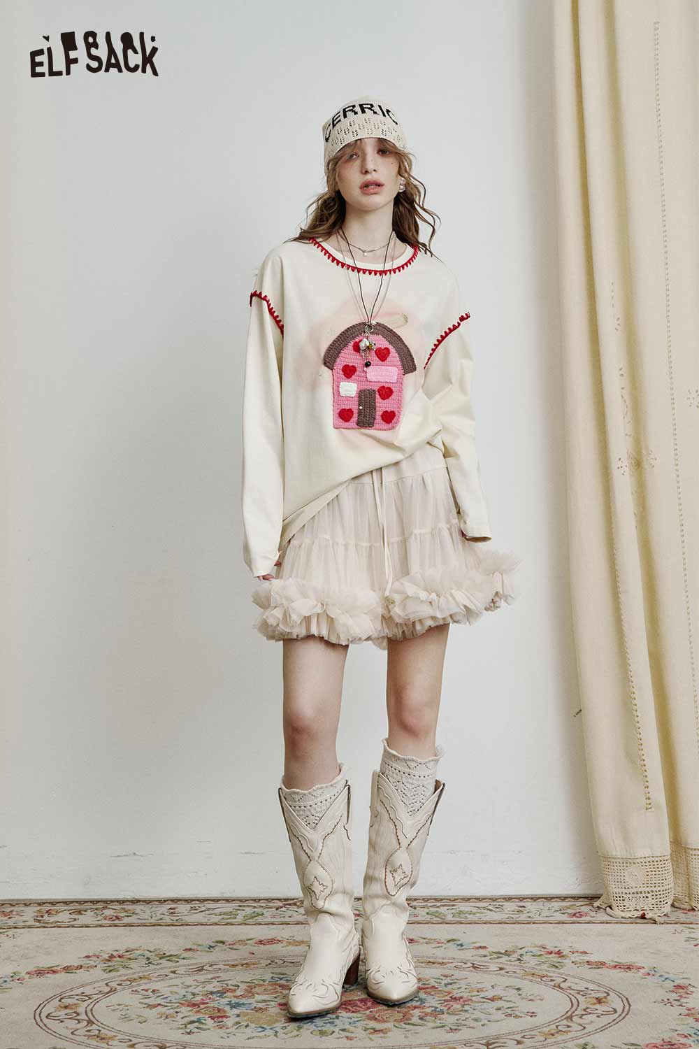 ELFSACK Ballerina style tulle skirt paired with a stylish top and cowboy boots, perfect for playful fashion