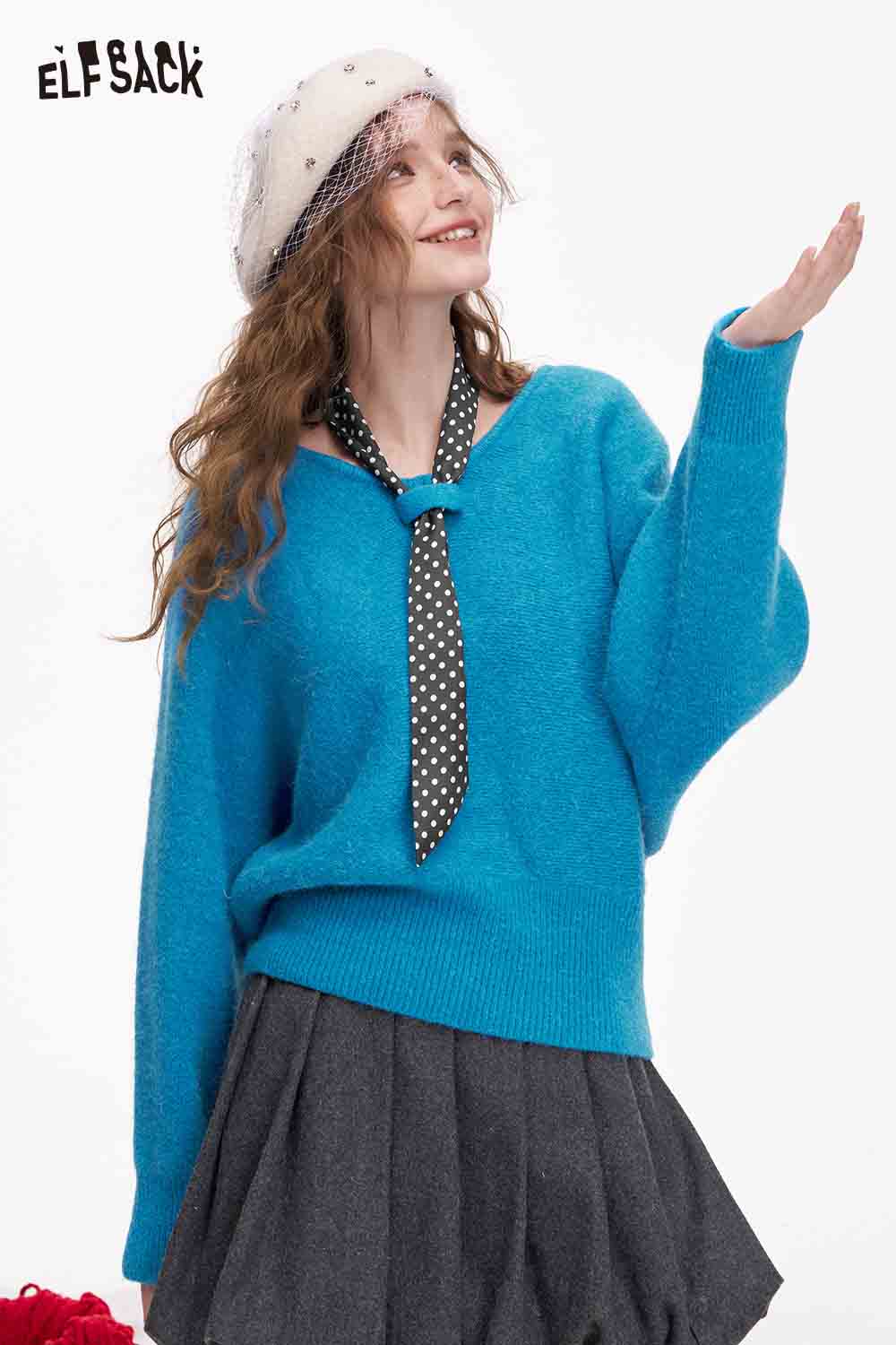 ELFSACK bat sleeve polka dot sweater in blue, paired with a stylish hat and tie for a trendy look