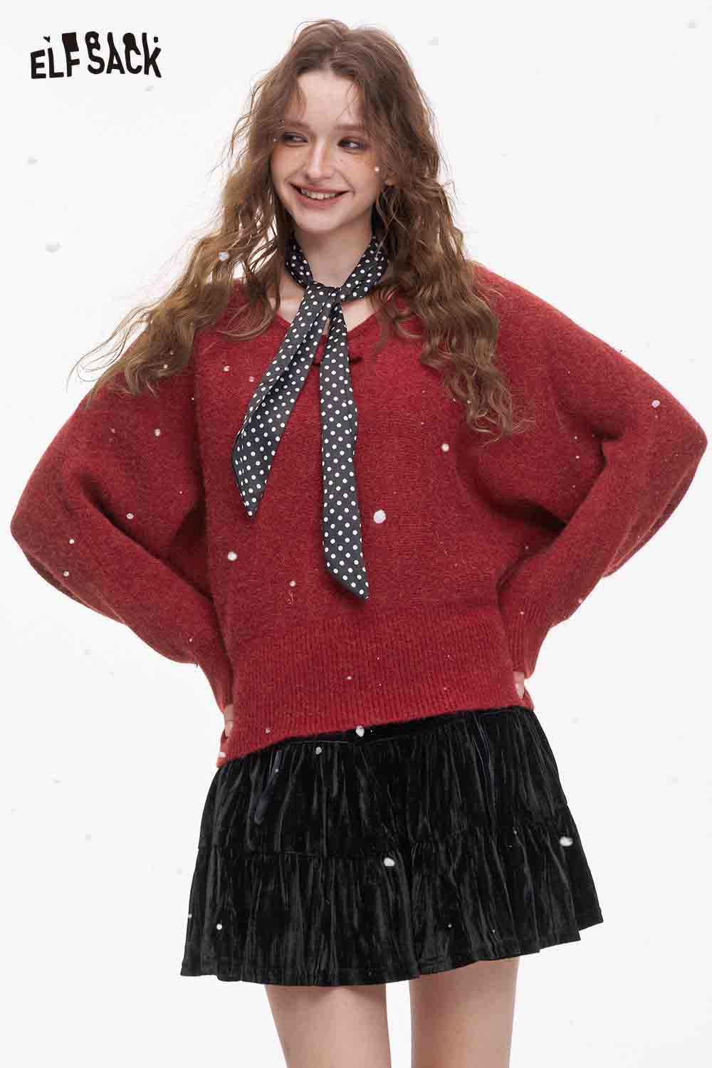 ELFSACK bat sleeve polka dot sweater in red, styled with a black ruffled skirt and scarf