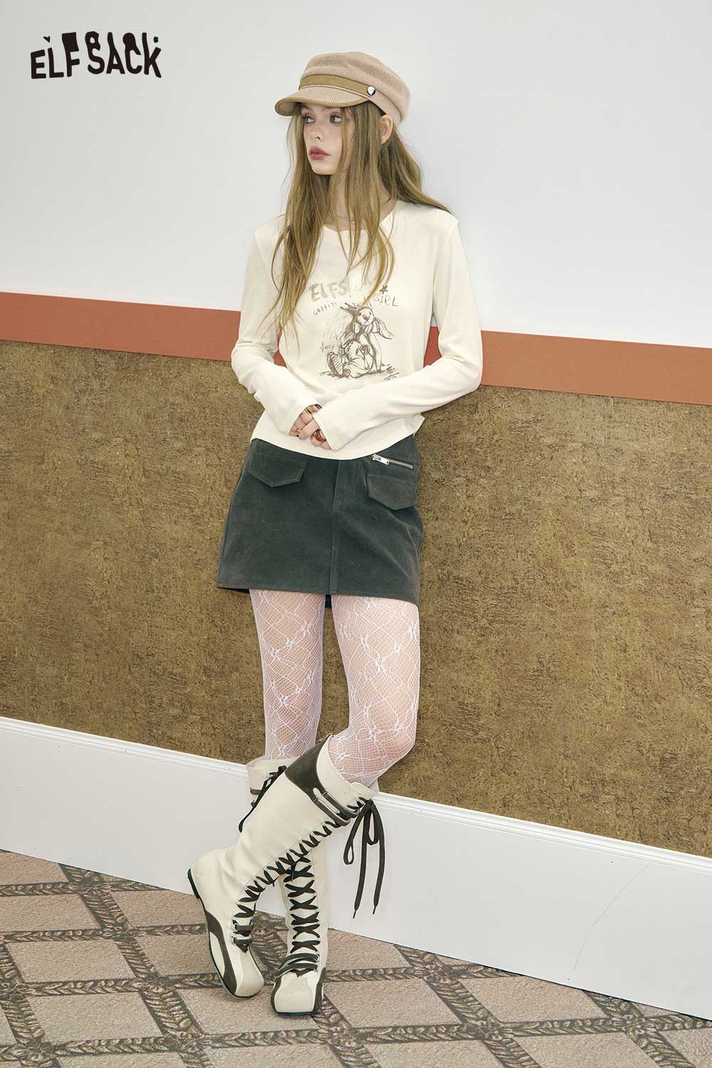 ELFSACK bear graphic relaxed fit tee styled with a black skirt and knit boots for a trendy look