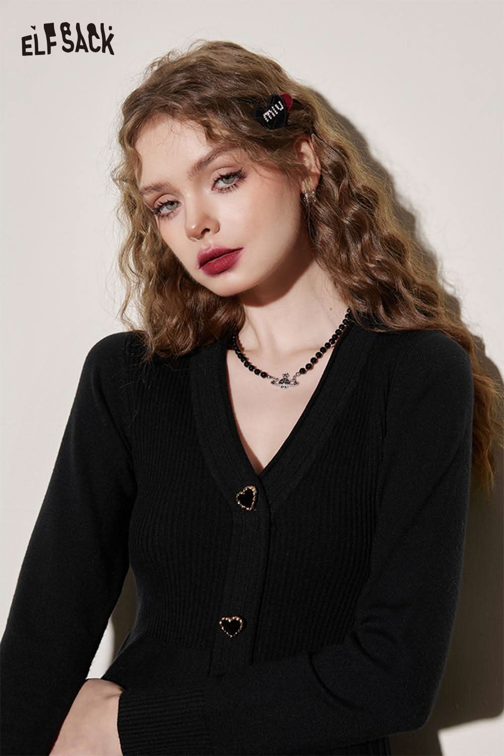 ELFSACK black knit sheath dress with a stylish heart button detail and long sleeves