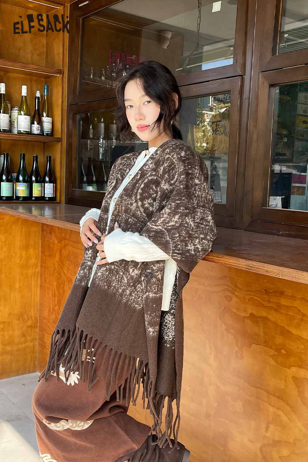 ELFSACK bohemian knit shawl with fringe, featuring a stylish design perfect for layering in any season