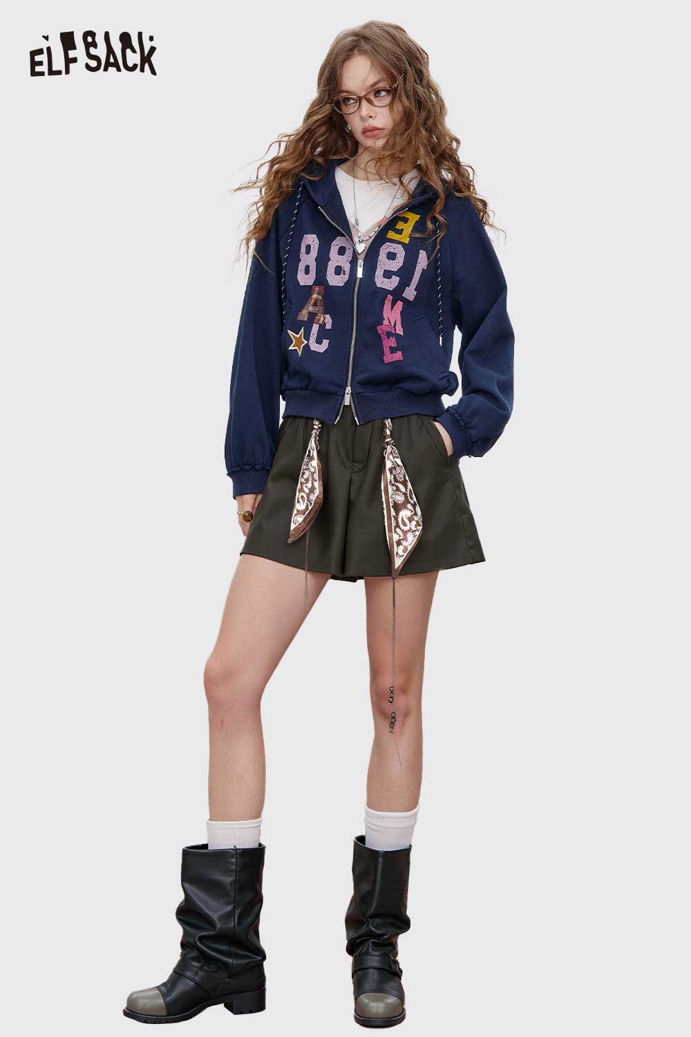 ELFSACK Bohemian Paisley Print Shorts styled with a graphic zip-up hoodie and knee-high boots