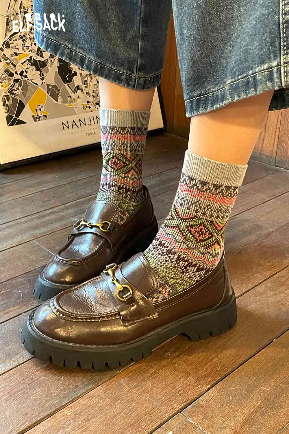 Stylish ELFSACK bohemian stripe socks for women paired with brown loafers and denim pants