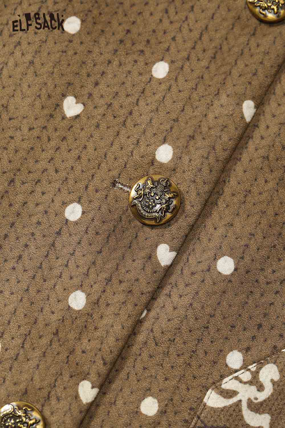 Close-up of ELFSACK bohemian suede vest for women featuring unique buttons and a polka dot pattern