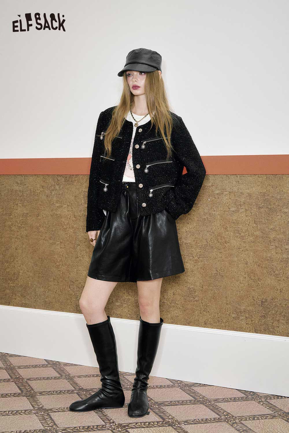 Stylish ELFSACK boucle wool short blazer for women paired with leather shorts and a hat