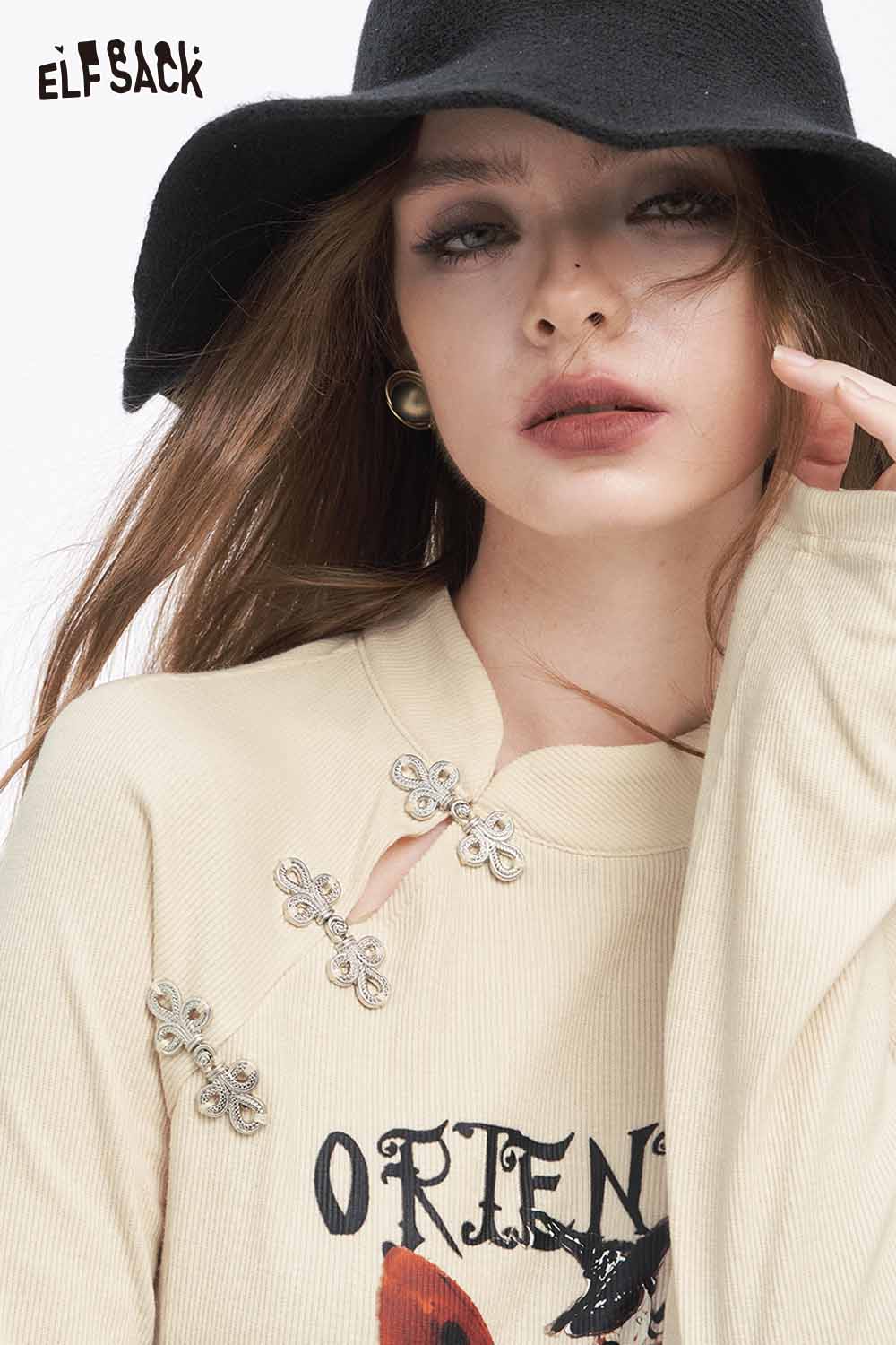 ELFSACK bow graphic long sleeve tshirt with unique butterfly embellishments and artistic design