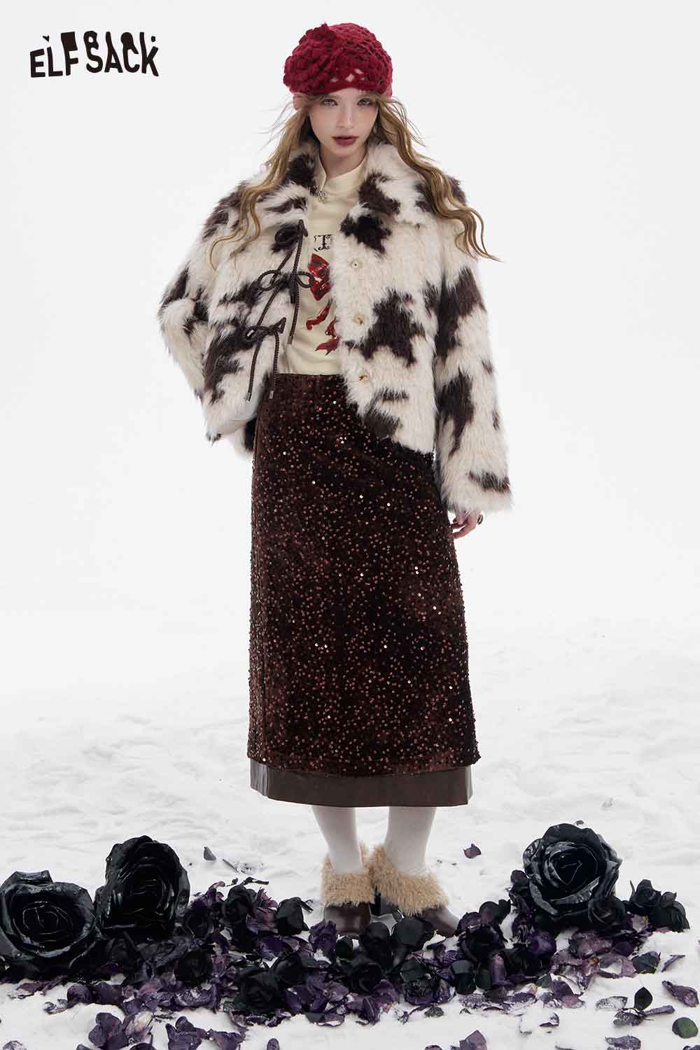 ELFSACK bow graphic long sleeve t-shirt paired with a stylish fuzzy coat and skirt for a chic winter look