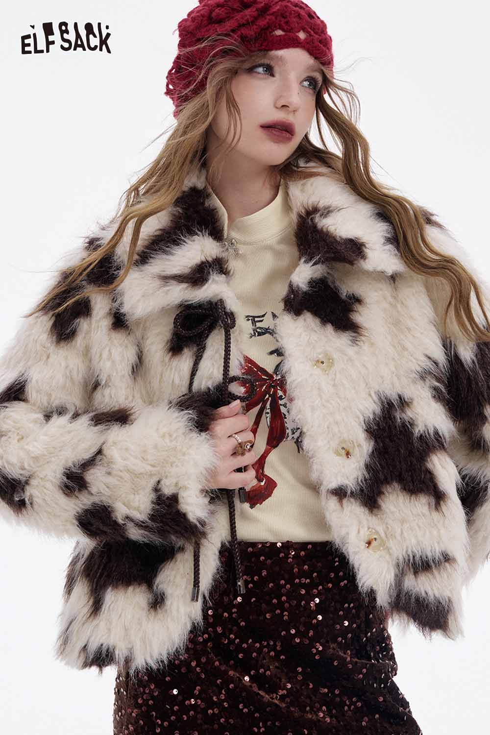 ELFSACK bow graphic long sleeve tshirt paired with a trendy fur coat and stylish accessories