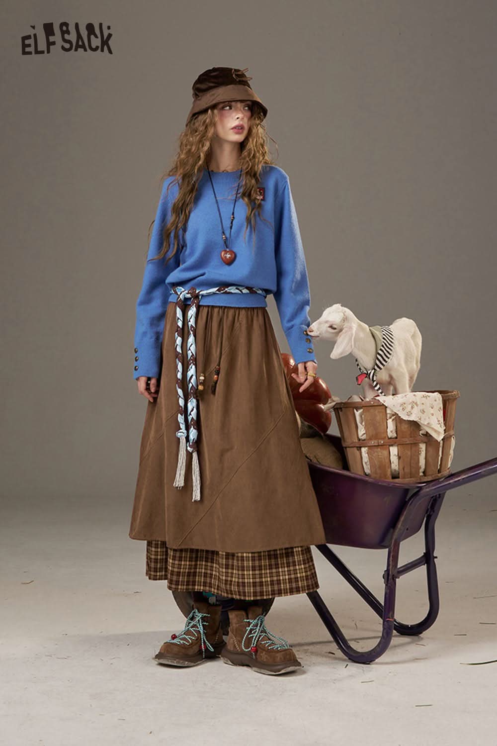 ELFSACK breathable lace patchwork skirt styled with a blue sweater and accessories for a trendy look