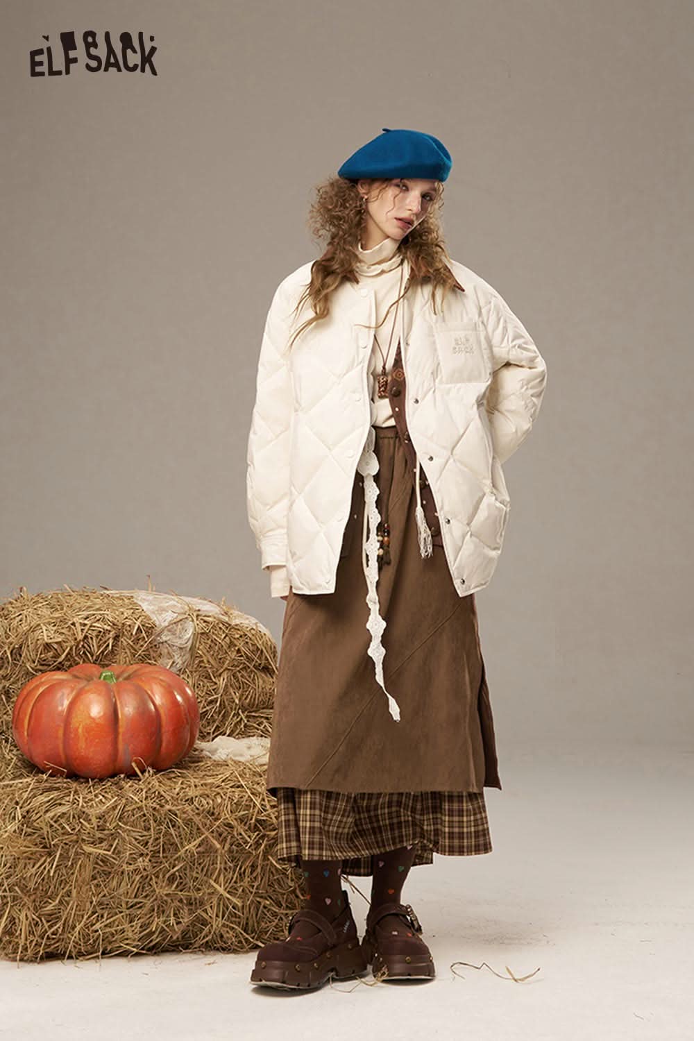 ELFSACK breathable lace patchwork skirt styled with a cozy quilted jacket and accessories