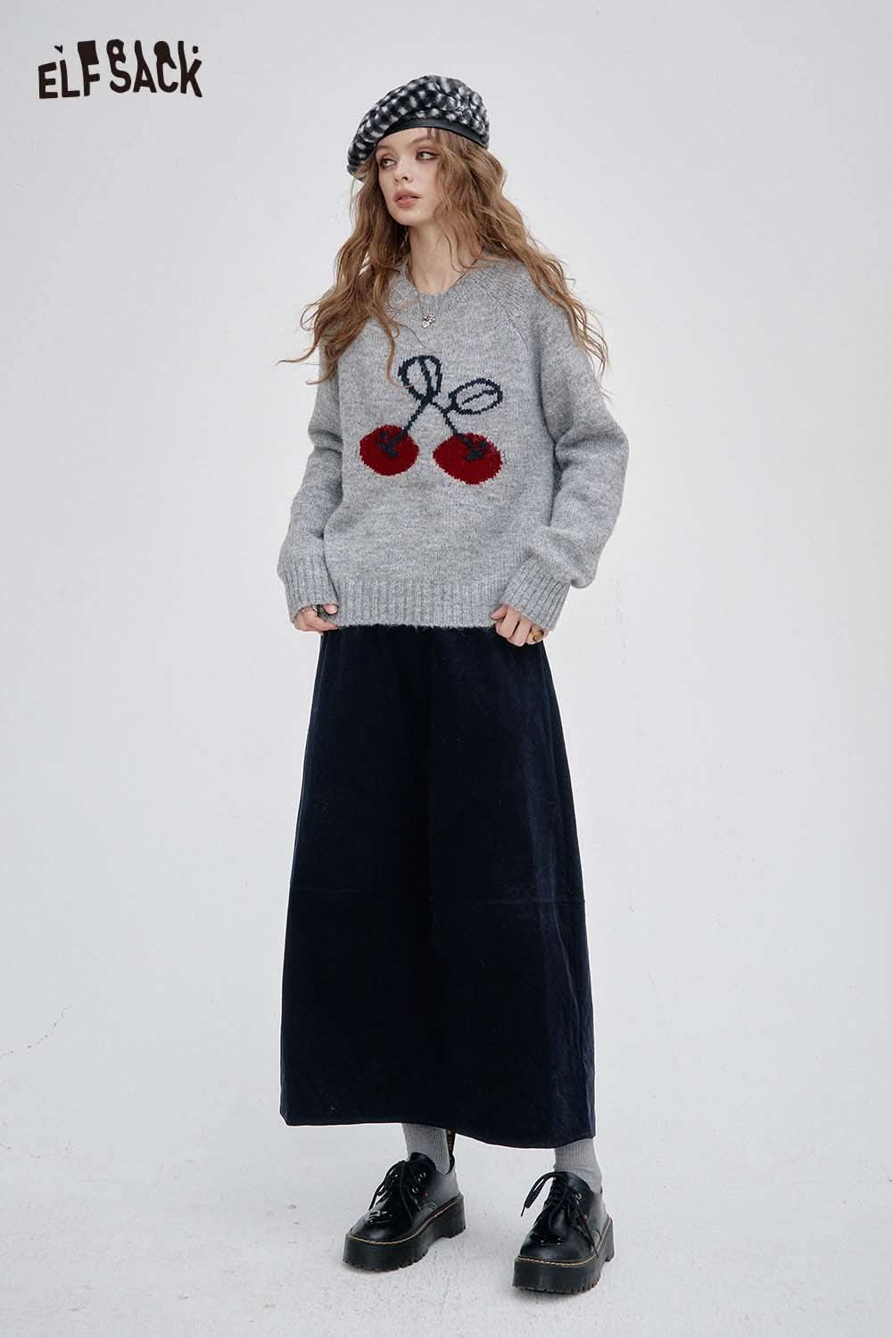 ELFSACK breathable midi skirt for women in dark fabric paired with a cozy sweater and accessories