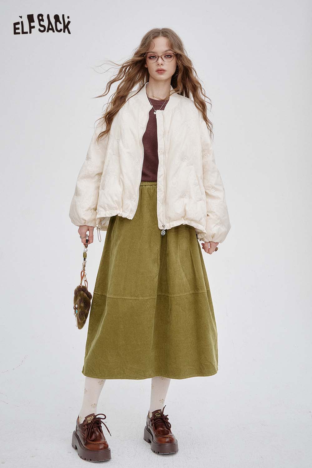 ELFSACK breathable midi skirt for women in olive green paired with a stylish bomber jacket