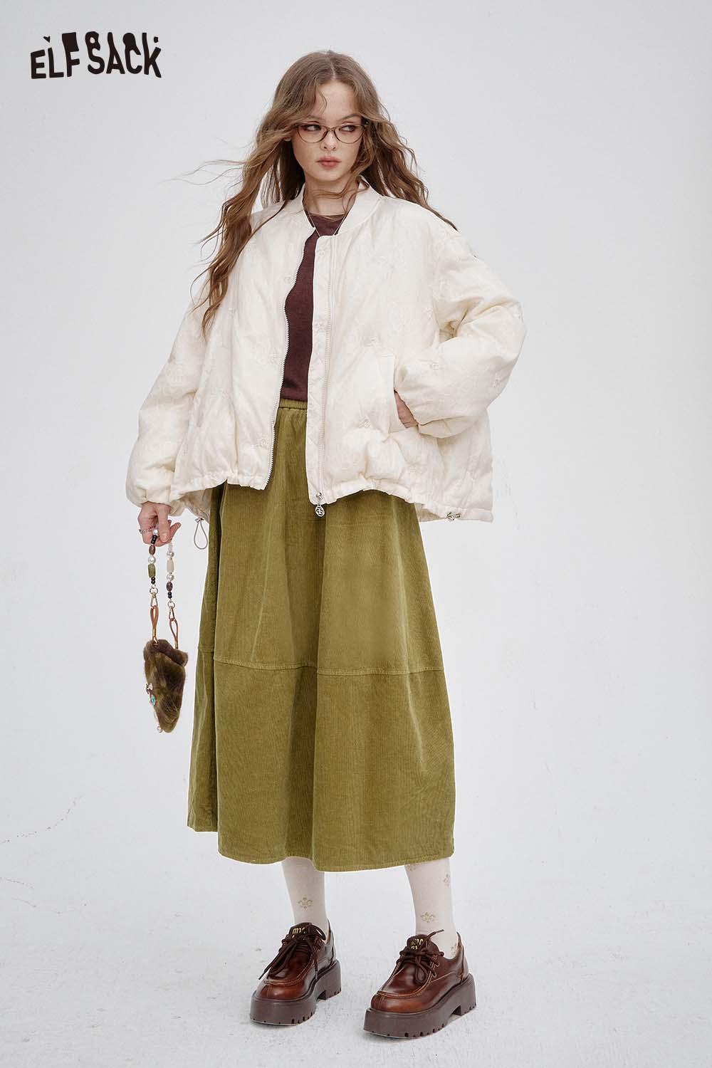ELFSACK breathable midi skirt for women in olive green paired with a stylish bomber jacket