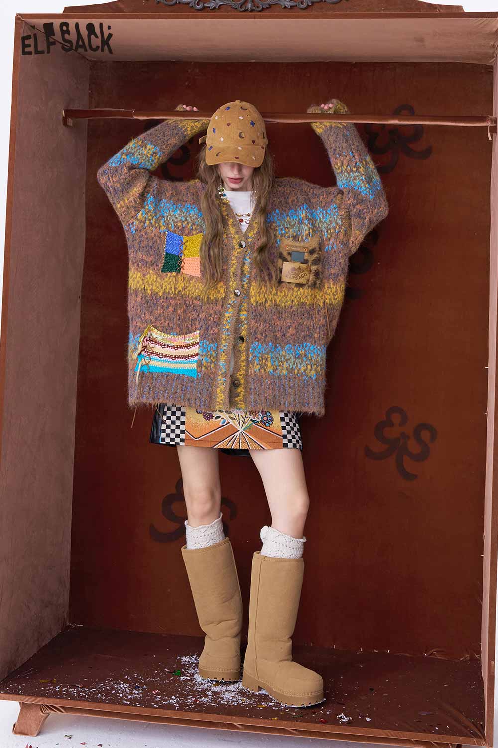 ELFSACK bright color V neck knit sweater with unique patterns worn by a model in a creative setting