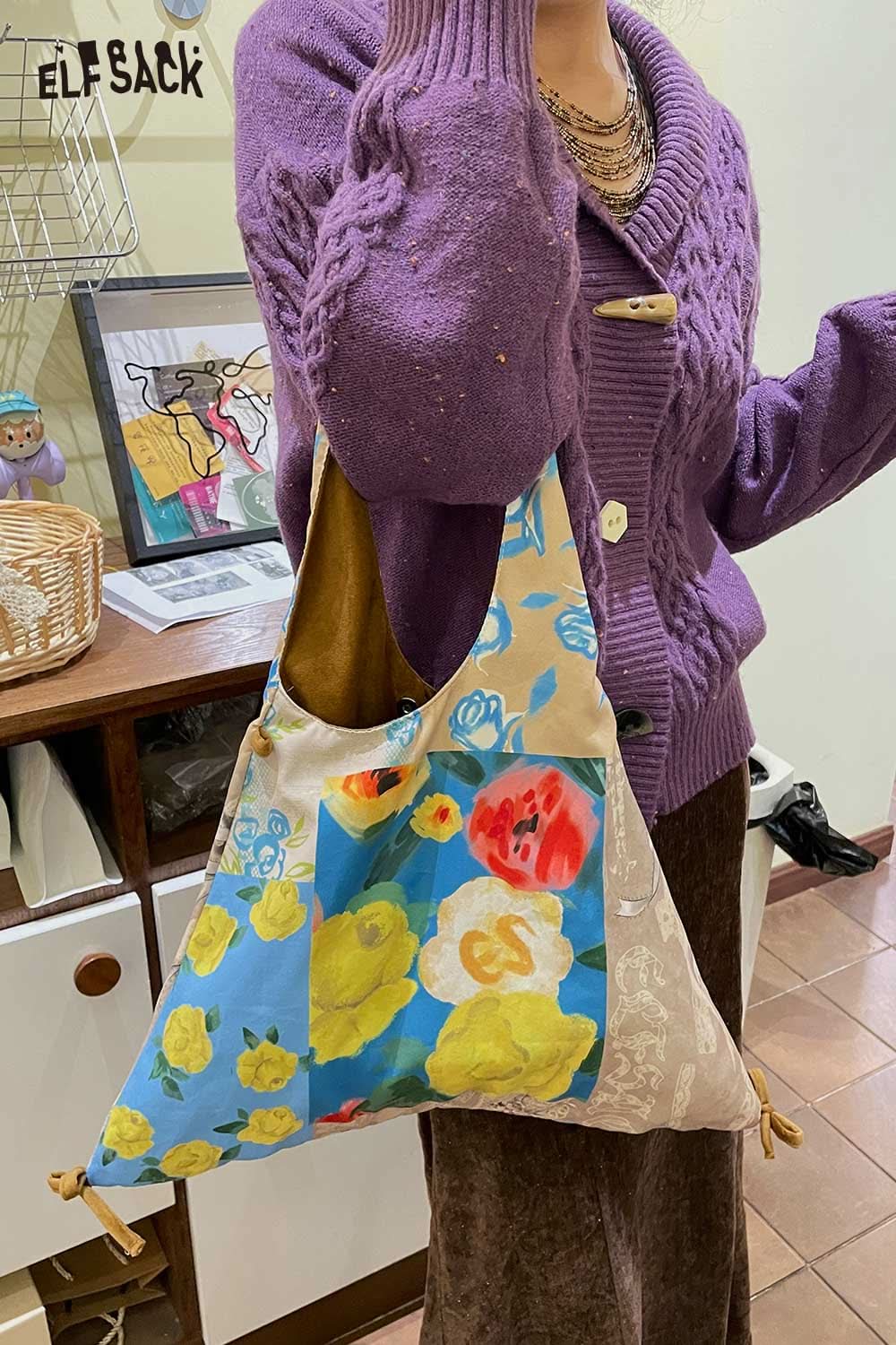 
                  
                    ELFSACK canvas color block tote bag with vibrant floral design and unique shape for stylish carrying
                  
                
