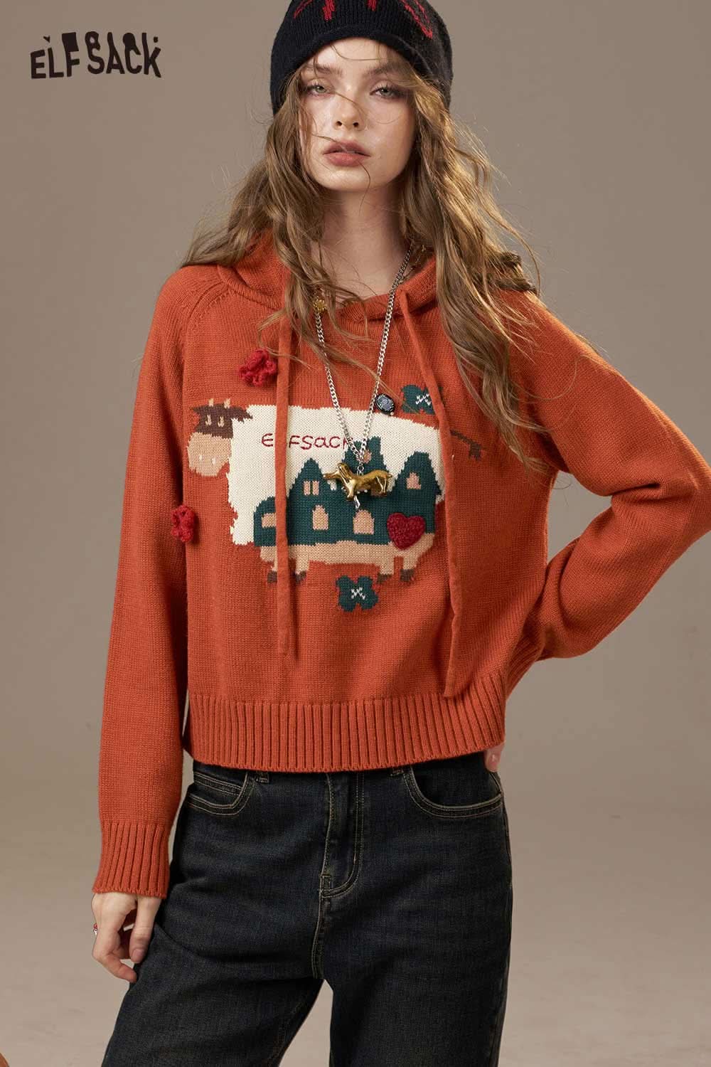 ELFSACK cartoon cow print hooded sweater in orange with unique embroidered design