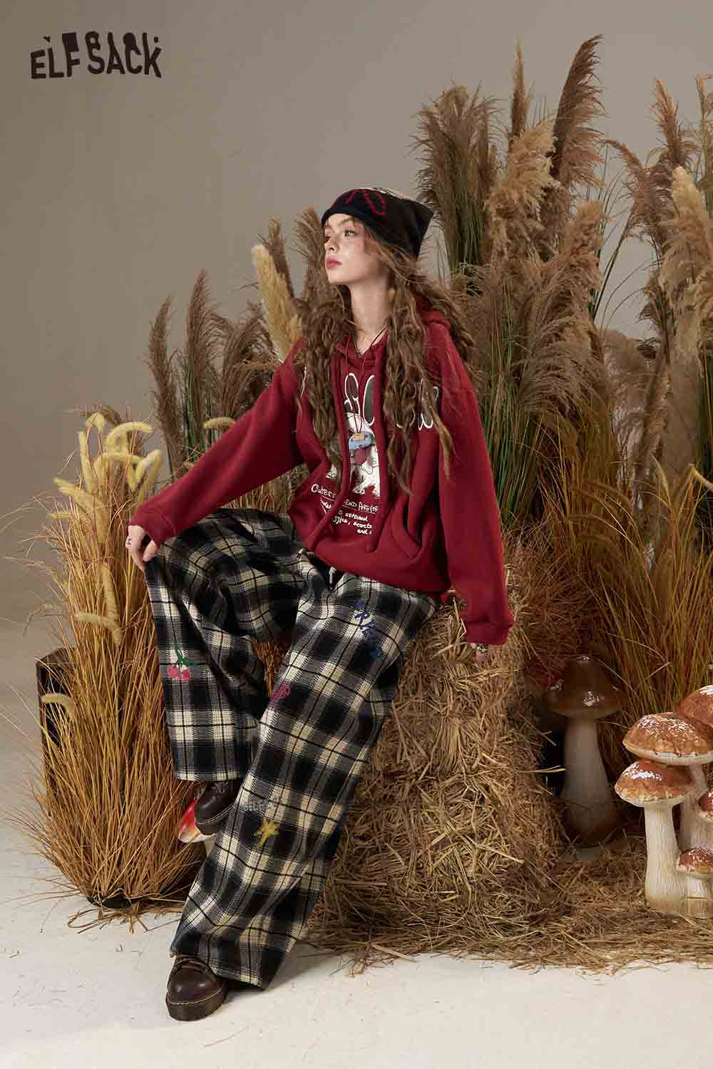ELFSACK cartoon elephant hooded sweatshirt in red paired with plaid pants for a stylish casual look