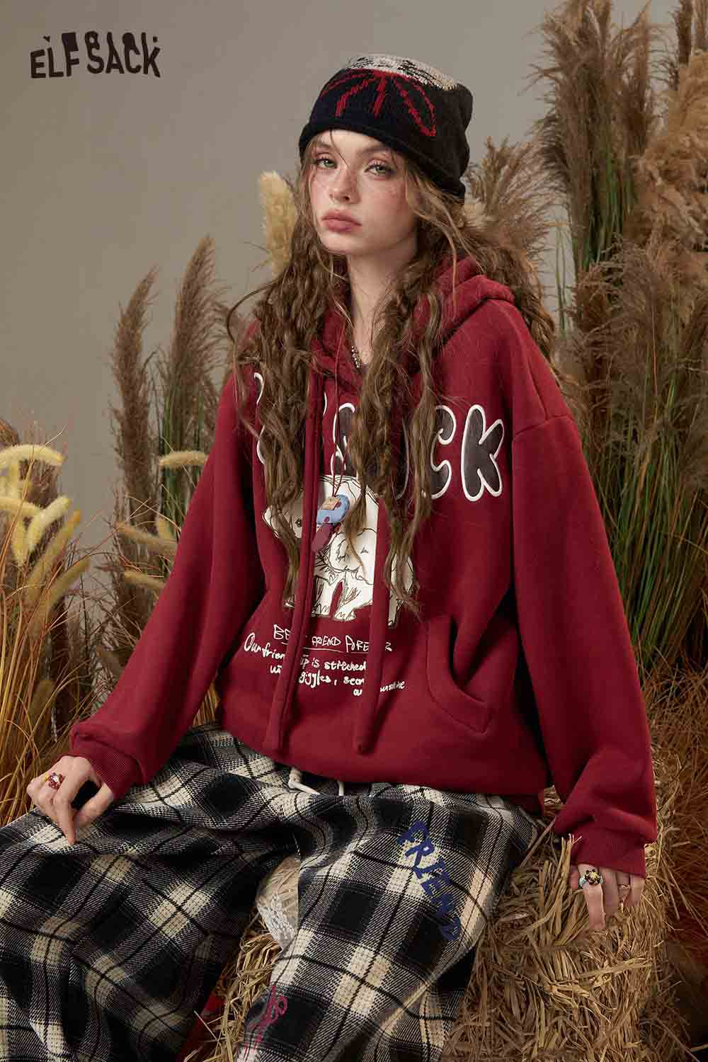 ELFSACK cartoon elephant hooded sweatshirt in red featuring a playful graphic design and cozy fit