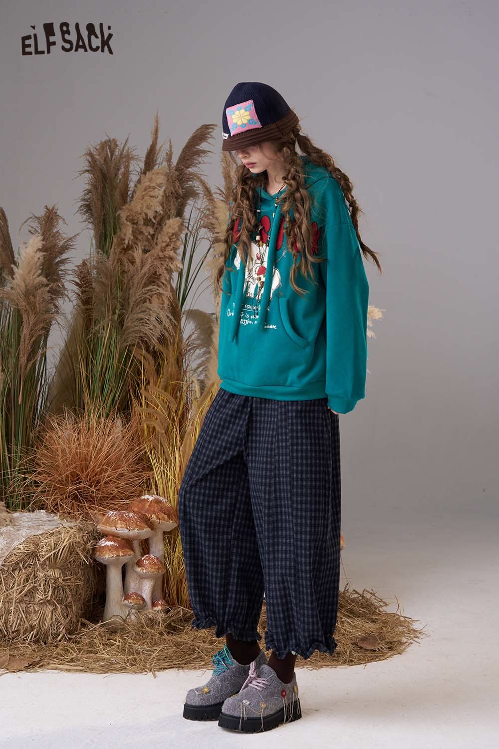 ELFSACK cartoon elephant hooded sweatshirt in teal paired with plaid pants for a stylish look