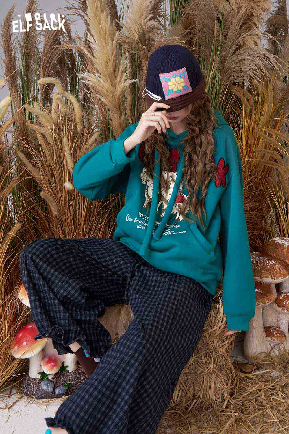ELFSACK cartoon elephant hooded sweatshirt in teal with vibrant floral accents and a relaxed fit