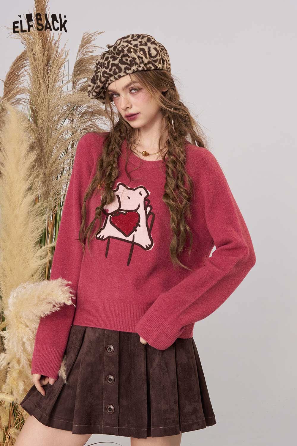 ELFSACK cartoon embroidery sweater in pink with heart design, paired with a brown skirt and stylish hat