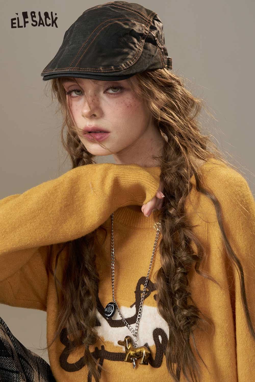 ELFSACK cartoon embroidery sweater in vibrant yellow worn with a stylish cap and braids