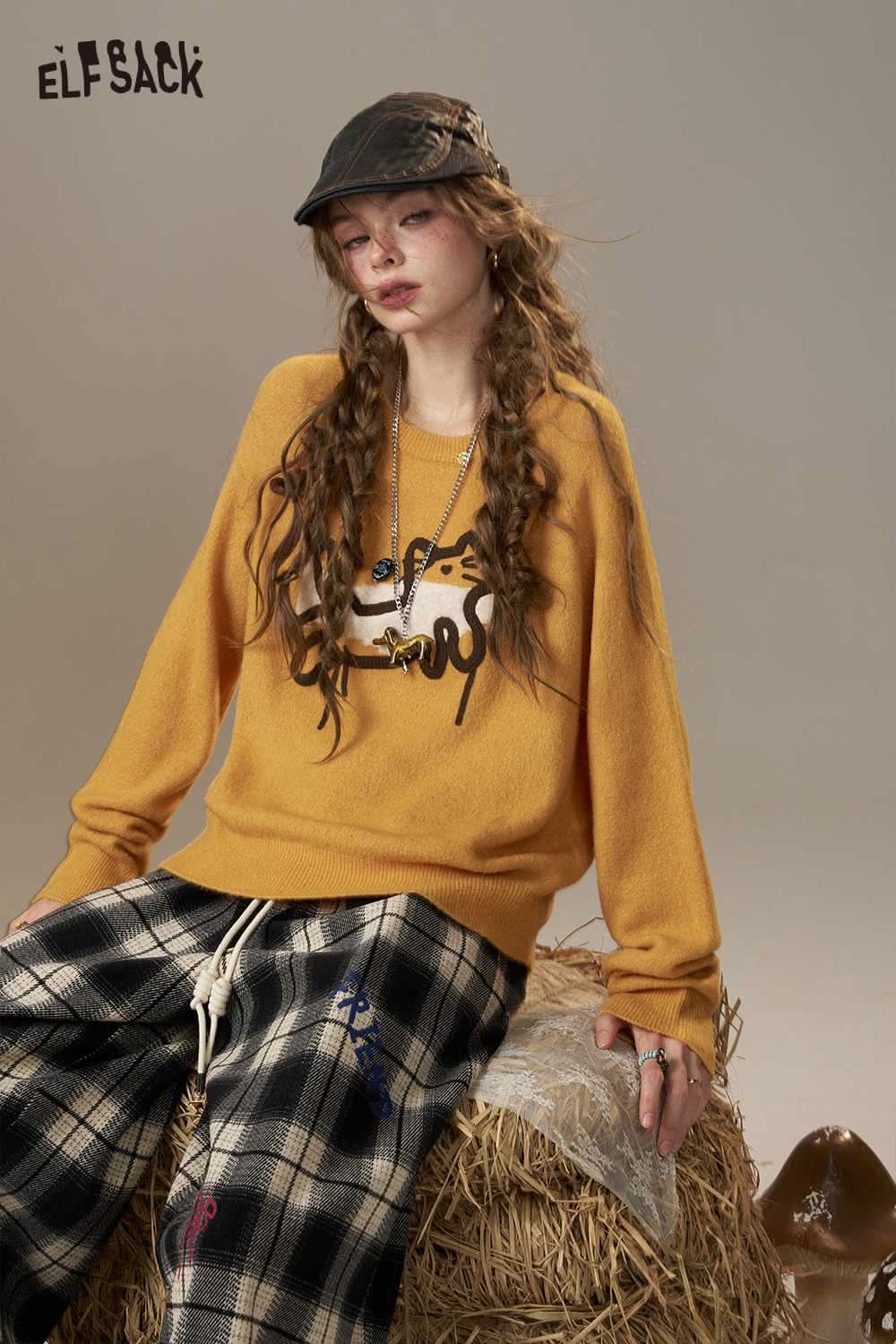ELFSACK cartoon embroidery sweater in mustard yellow with relaxed fit and playful design