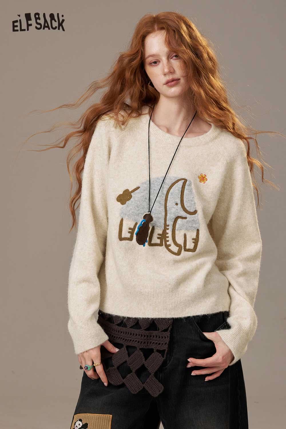 Cream ELFSACK cartoon embroidery sweater featuring an elephant design and soft fabric texture