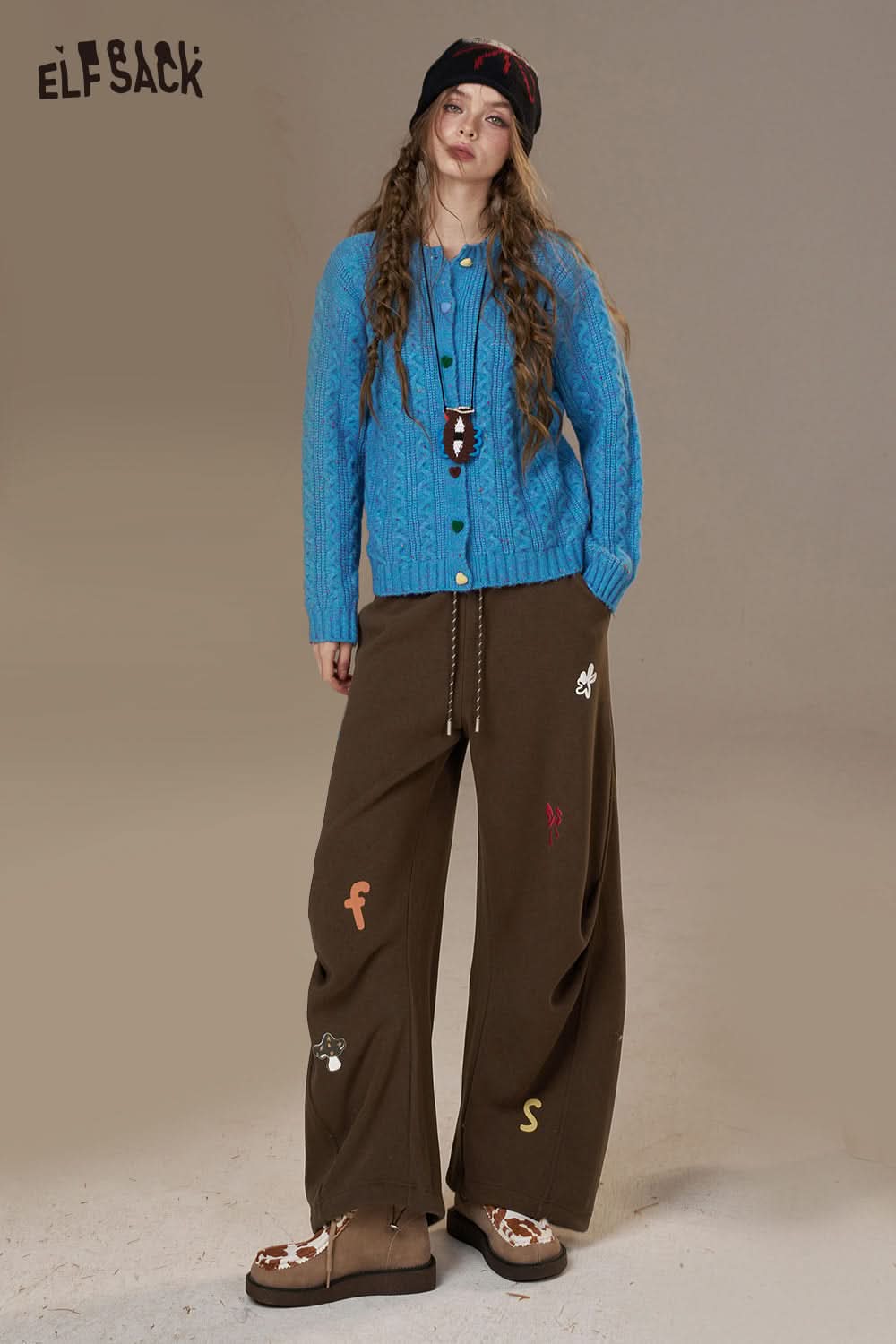 ELFSACK cartoon embroidery sweatpants for women in brown with colorful designs and a relaxed fit