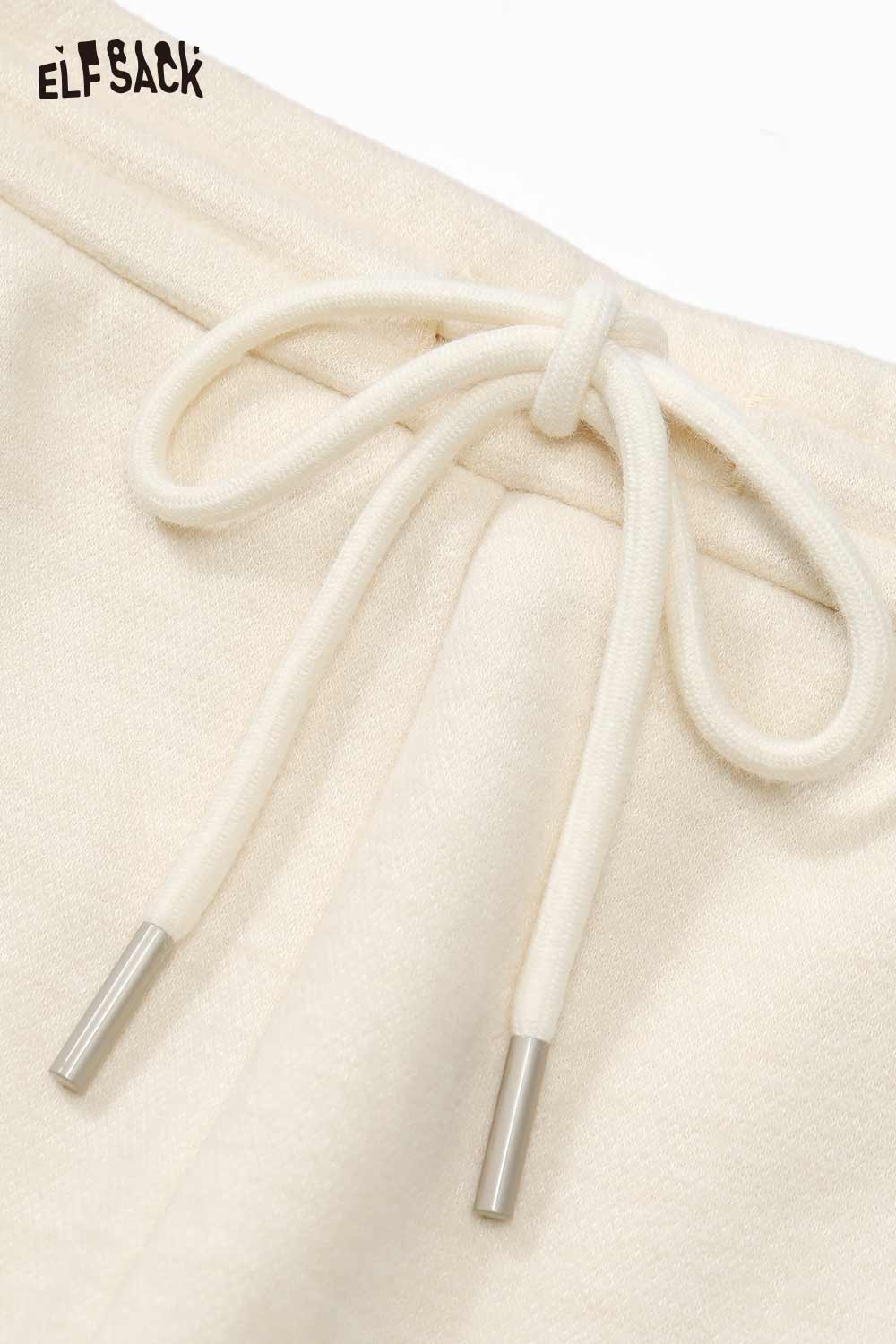 ELFSACK cartoon embroidery sweatpants for women featuring a drawstring closure in cream color