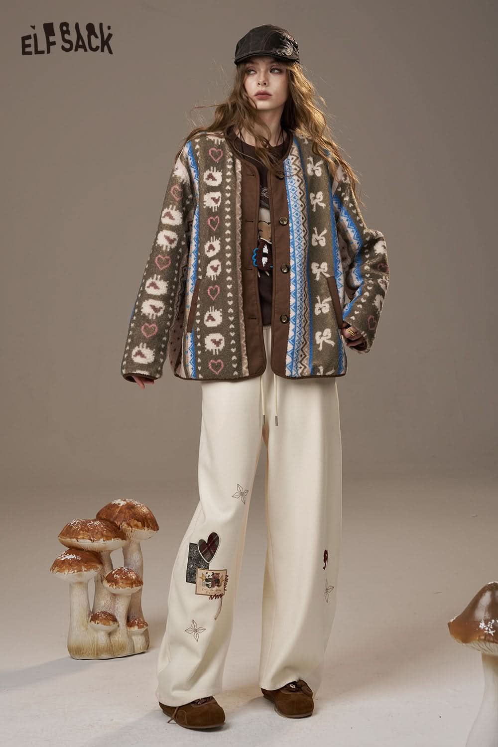 ELFSACK cartoon embroidery sweatpants for women in a relaxed fit, styled with a cozy jacket