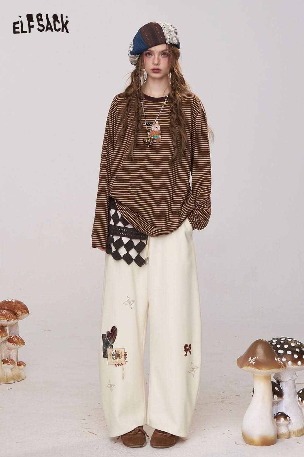ELFSACK women's cartoon embroidery sweatpants in cream with playful designs for a trendy look