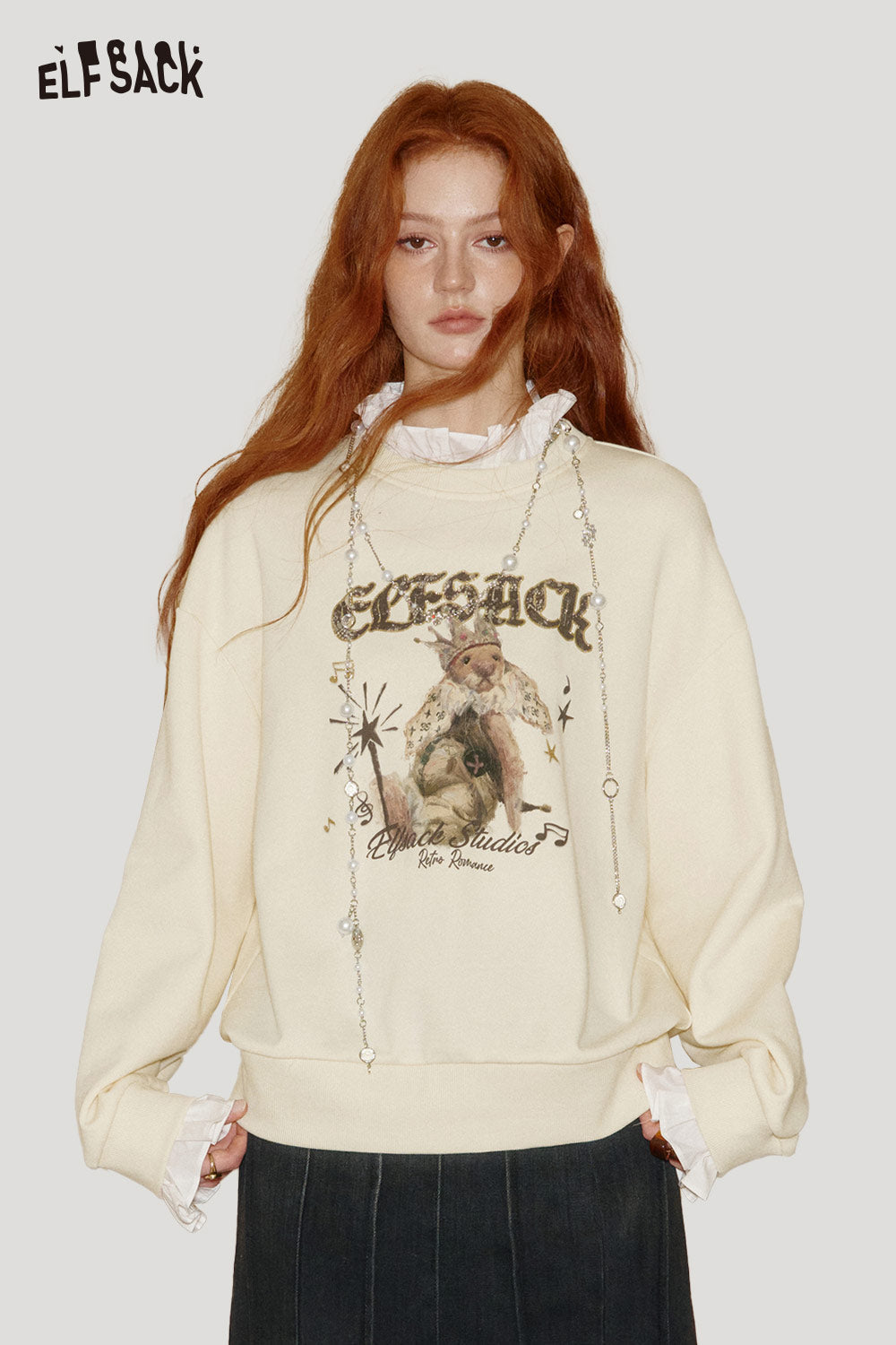 ELFSACK cartoon graphic ruffle sweatshirt in cream with trendy design and stylish ruffled collar