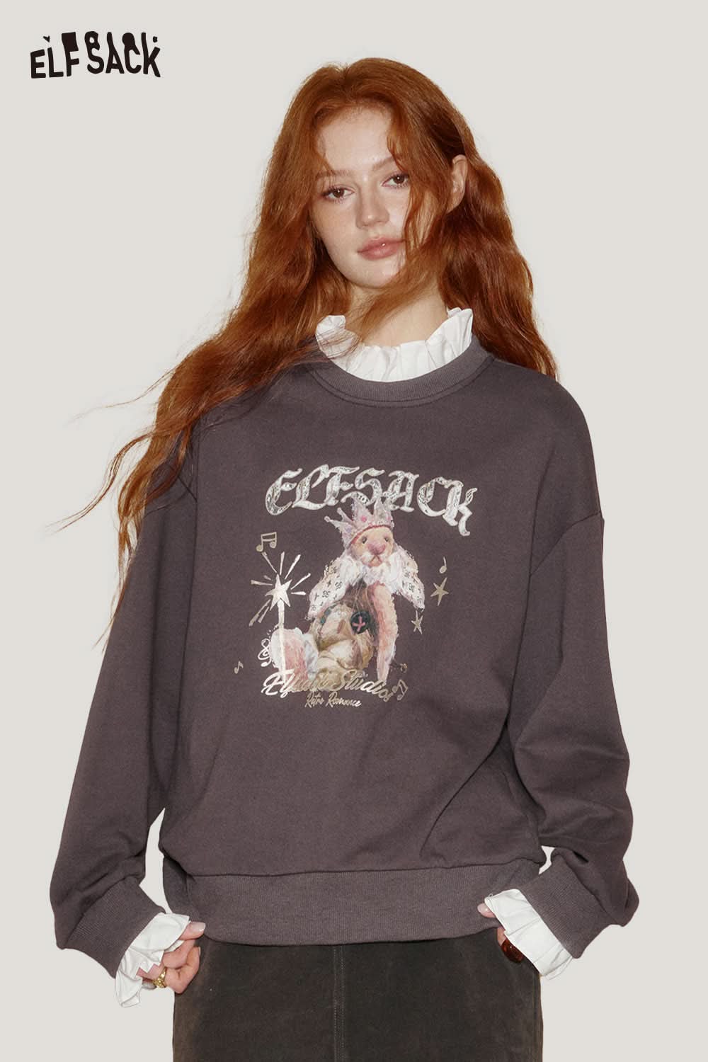 ELFSACK cartoon graphic ruffle sweatshirt in dark color with playful design and relaxed fit