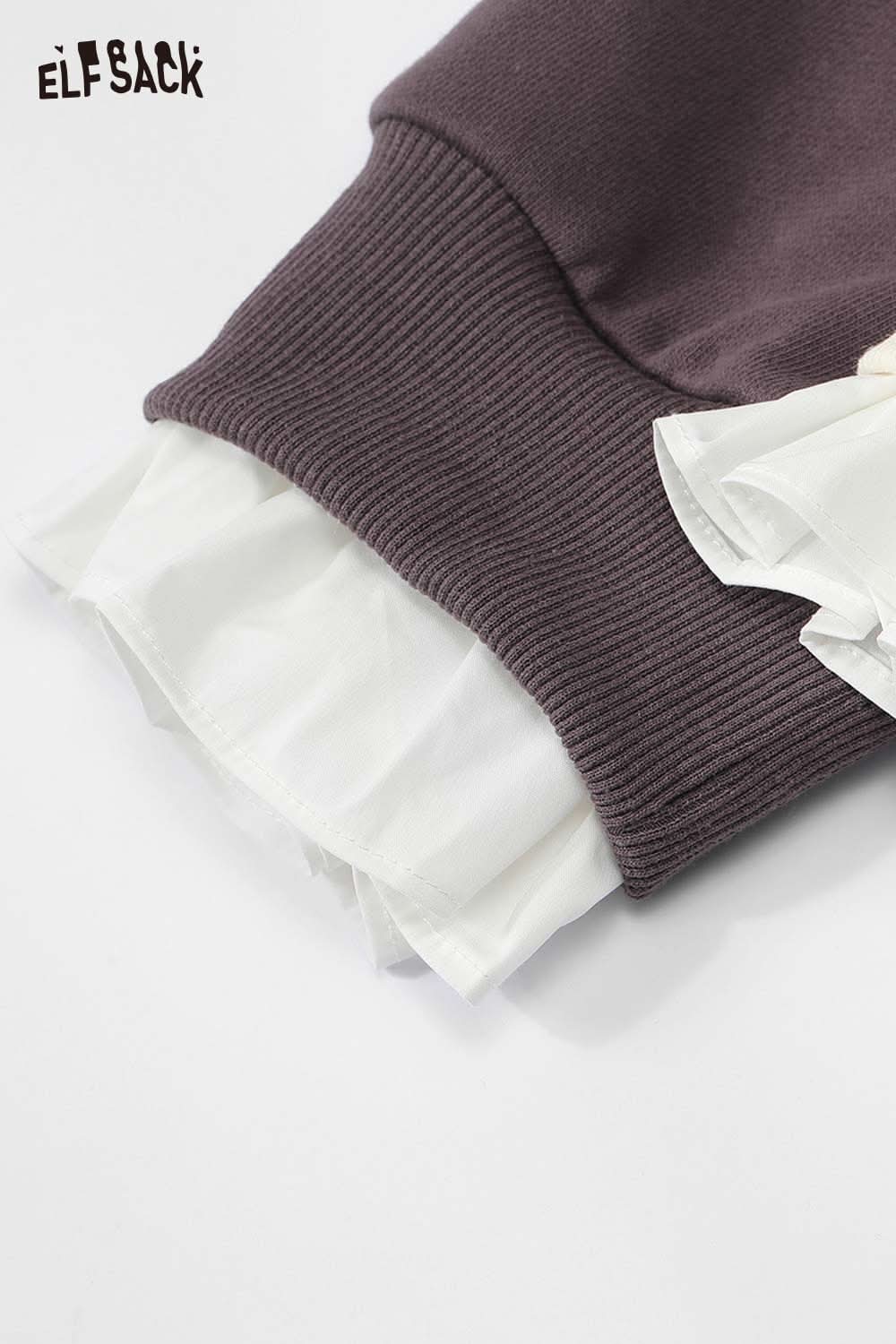 Close-up of ELFSACK cartoon graphic ruffle sweatshirt showcasing the unique ruffle detail at the cuff