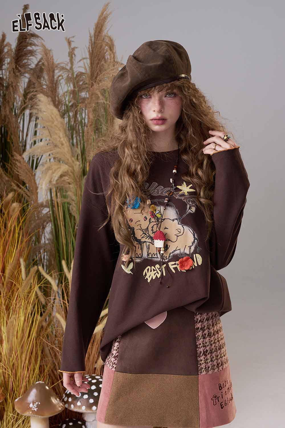 ELFSACK cartoon print long sleeve tee in brown featuring playful graphics and a relaxed fit