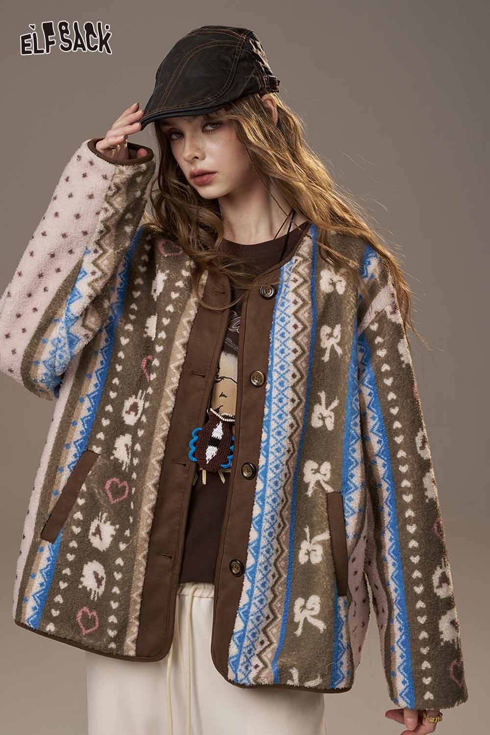 ELFSACK cartoon print long sleeve tee layered under a stylish patterned jacket