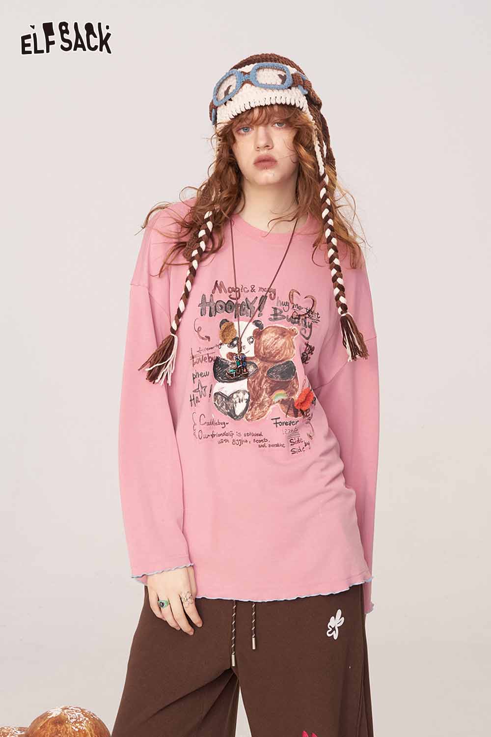 ELFSACK cartoon print long sleeve tee in pink featuring playful graphics and a relaxed fit
